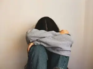 Woman experiencing anxiety while avoiding social situations in Scotch Plains, New Jersey - somatic therapy can help